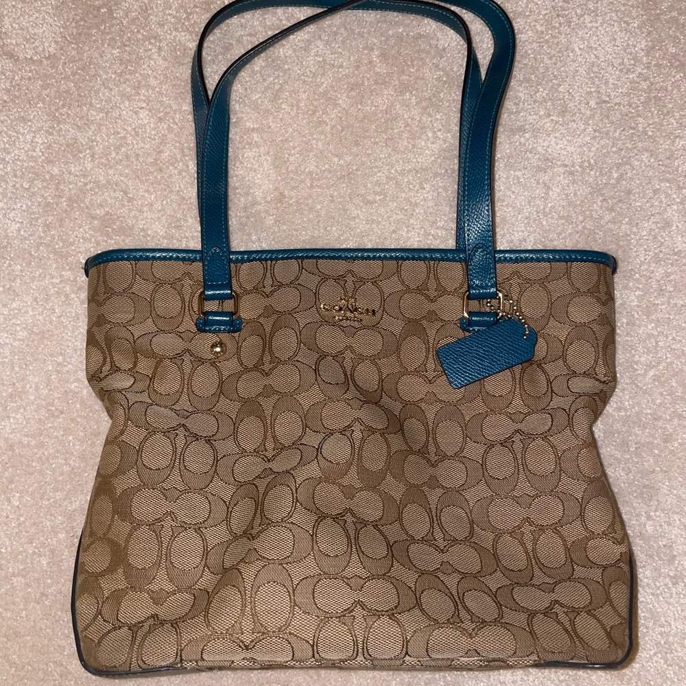 Tan and teal Coach handbag